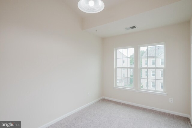5207 Wyndholme Cir Unit 402, Baltimore, MD 21229 - spare room featuring baseboards, visible vents, and light colored carpet