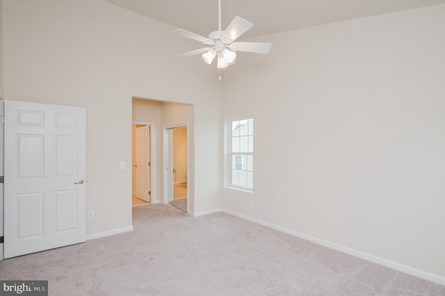 5207 Wyndholme Cir Unit 402, Baltimore, MD 21229 - unfurnished bedroom featuring baseboards, a high ceiling, and carpet floors