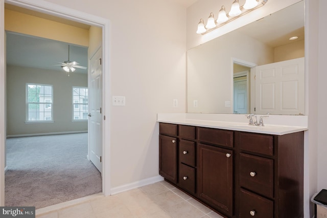 5207 Wyndholme Cir Unit 402, Baltimore, MD 21229 - bathroom with vanity, baseboards, a ceiling fan, and tile patterned flooring