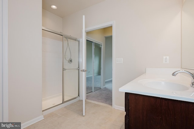 5207 Wyndholme Cir Unit 402, Baltimore, MD 21229 - full bathroom with a shower stall, baseboards, vanity, and tile patterned flooring
