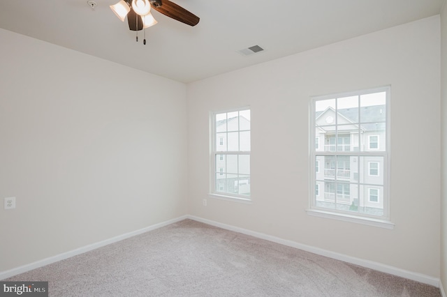 5207 Wyndholme Cir Unit 402, Baltimore, MD 21229 - spare room featuring carpet, visible vents, and a healthy amount of sunlight