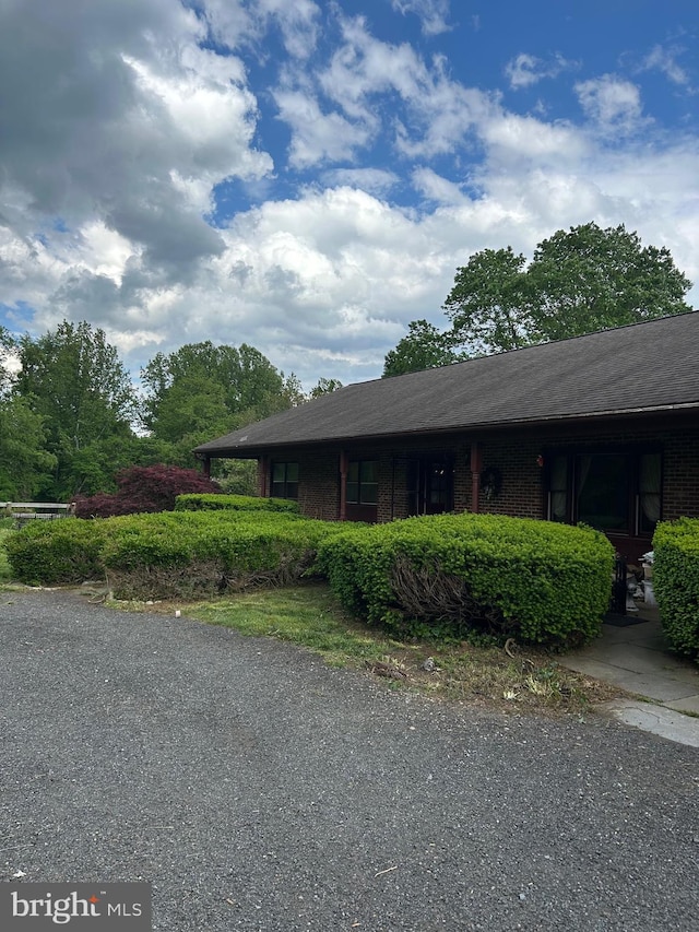 view of home's exterior featuring brick siding