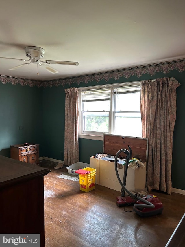 bedroom featuring ceiling fan and wood finished floors