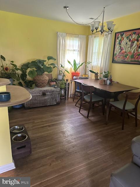 9011 Spring Acres Rd, Clinton, MD 20735 - dining space featuring a chandelier and wood finished floors