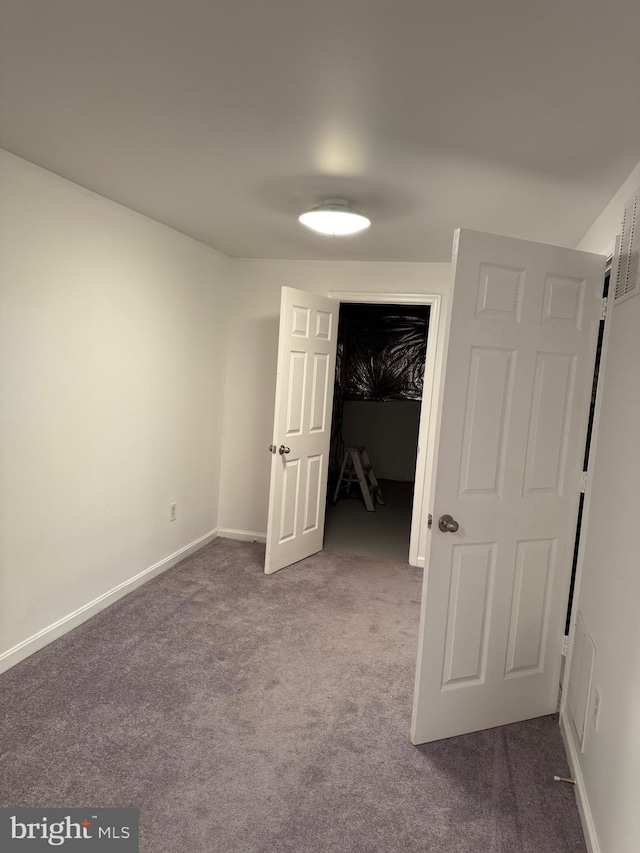 6 Chriswell Ct, Rosedale, MD 21237 - unfurnished bedroom featuring a walk in closet, baseboards, carpet, and a closet