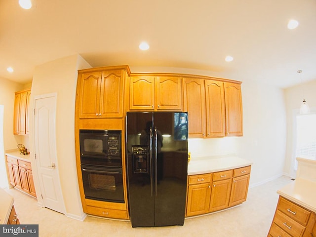 kitchen featuring pendant lighting, baseboards, recessed lighting, light countertops, and black appliances