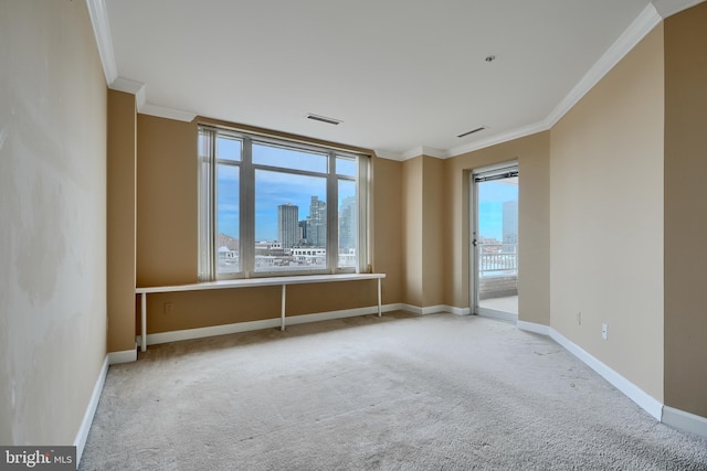 unfurnished room with ornamental molding, carpet flooring, baseboards, and a city view