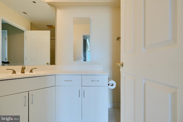 bathroom with vanity and tile patterned flooring