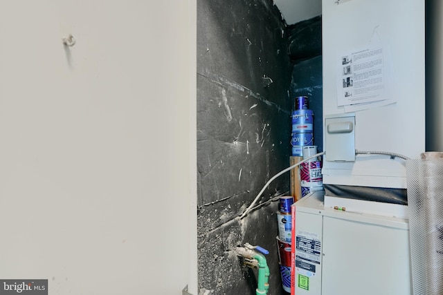 utility room featuring heating unit