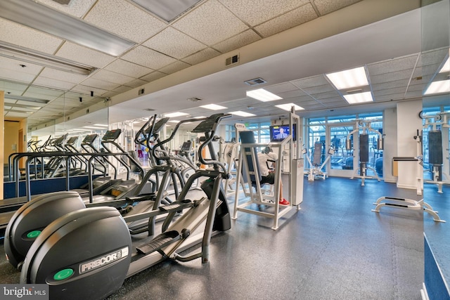 gym featuring a drop ceiling