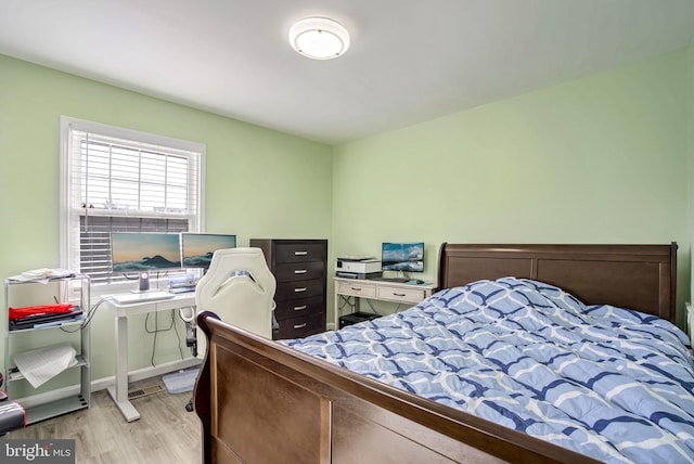 bedroom with wood finished floors