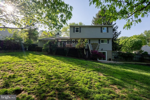 9801 Pulham Rd, Burke, VA 22015 - rear view of house with a lawn, fence, stairway, and a deck