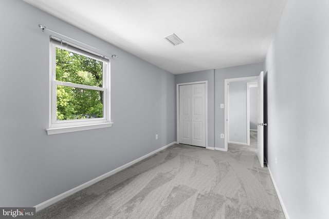 9801 Pulham Rd, Burke, VA 22015 - unfurnished bedroom featuring baseboards, carpet, visible vents, and a closet