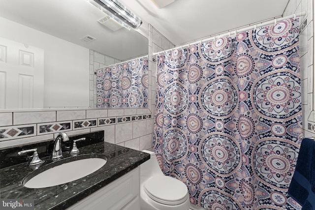 9801 Pulham Rd, Burke, VA 22015 - bathroom with vanity, shower / tub combo, backsplash, and toilet