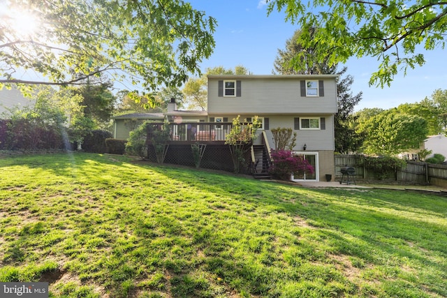 9801 Pulham Rd, Burke, VA 22015 - back of property with a lawn, a deck, stairs, and a fenced backyard