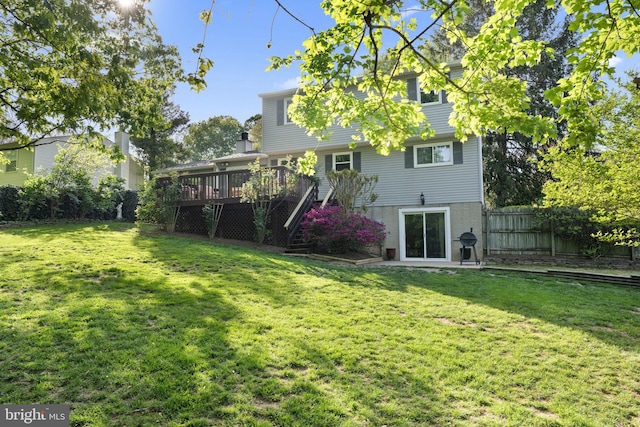 9801 Pulham Rd, Burke, VA 22015 - back of house featuring a yard, fence, a wooden deck, and stairs
