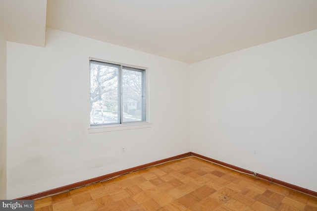 empty room with baseboards