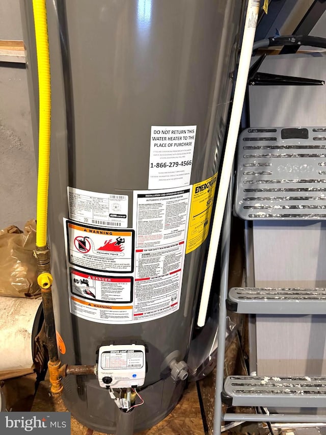 utility room featuring gas water heater