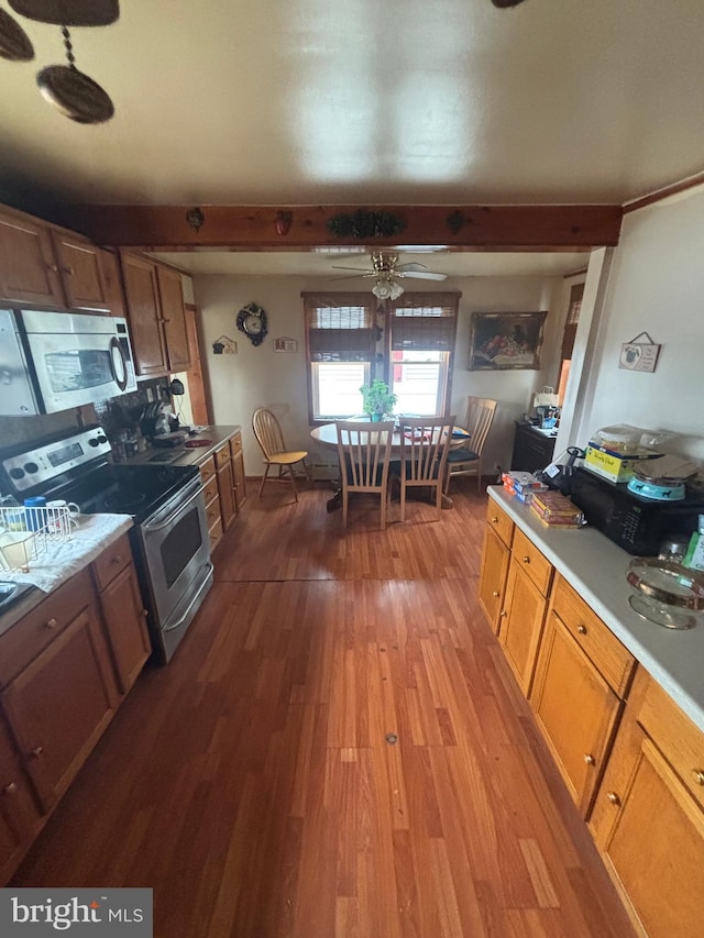 526 Bainbridge Ave, Mays Landing, NJ 08330 - kitchen with dark wood-style flooring, light countertops, ceiling fan, brown cabinets, and stainless steel appliances