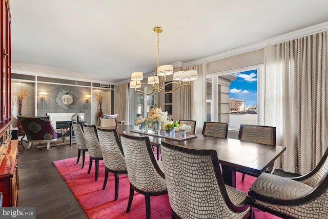 dining area featuring a notable chandelier and wood finished floors