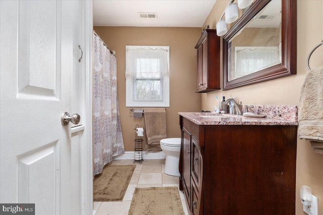 full bath with vanity, a shower with curtain, visible vents, toilet, and tile patterned floors