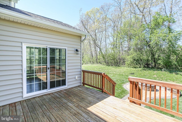 deck featuring a lawn