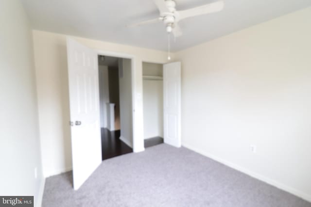 unfurnished bedroom with a ceiling fan, carpet floors, and a closet