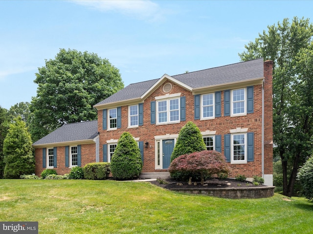 21 Griswold Ct, Sterling, VA 20165 - colonial-style house with a front lawn and brick siding