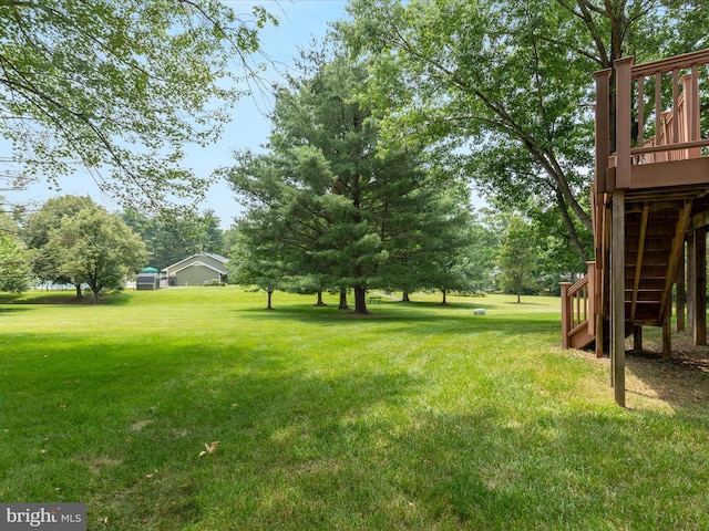 21 Griswold Ct, Sterling, VA 20165 - view of grassy yard with stairway and a wooden deck