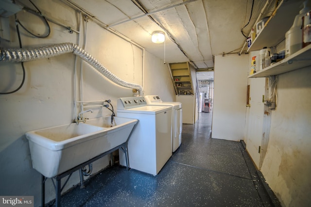 laundry room featuring washing machine and clothes dryer and laundry area