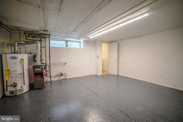 basement featuring gas water heater and a heating unit