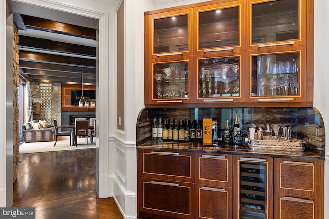 bar with decorative backsplash, dark wood-style flooring, wine cooler, beamed ceiling, and bar area