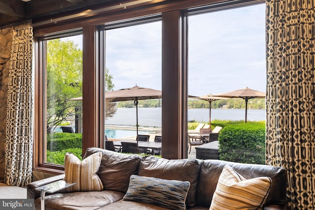 interior space featuring a water view and a healthy amount of sunlight
