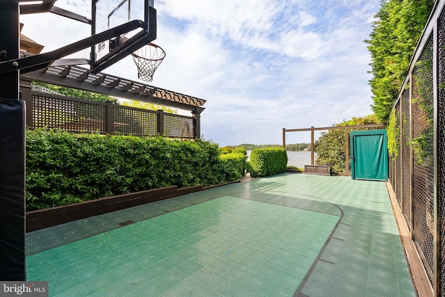 view of basketball court featuring basketball court and a pergola