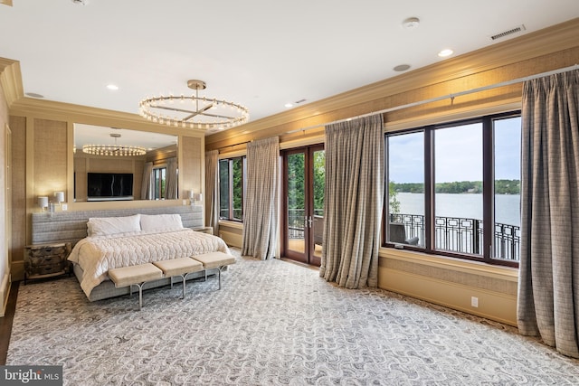 bedroom with visible vents, ornamental molding, a water view, and access to outside