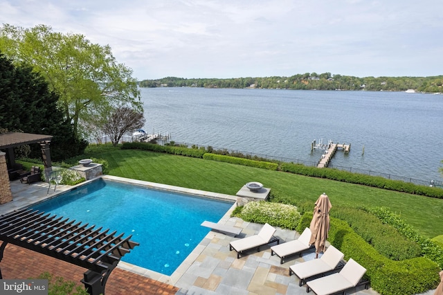 view of pool with a fenced in pool, a patio area, a diving board, a yard, and a water view