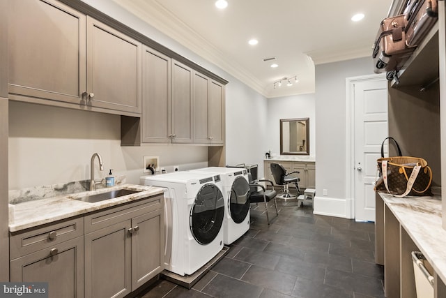 washroom with washing machine and clothes dryer, cabinet space, a sink, ornamental molding, and recessed lighting