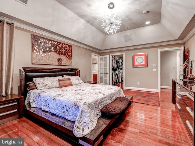 6 Paladia Way, Pikesville, MD 21208 - bedroom with crown molding, baseboards, hardwood / wood-style floors, a spacious closet, and a notable chandelier
