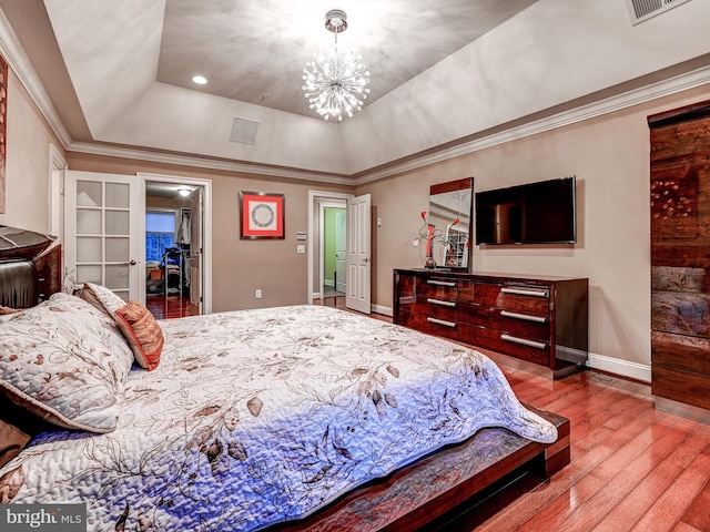 6 Paladia Way, Pikesville, MD 21208 - bedroom with a tray ceiling, an inviting chandelier, ornamental molding, baseboards, and wood finished floors