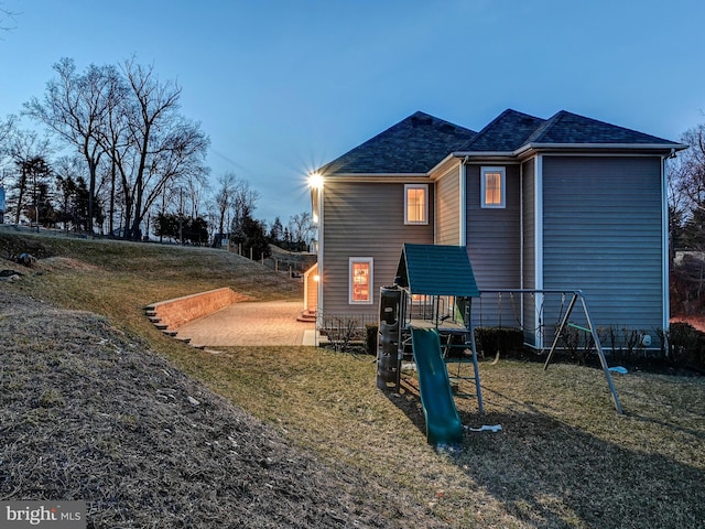 6 Paladia Way, Pikesville, MD 21208 - rear view of property with a shingled roof and a playground
