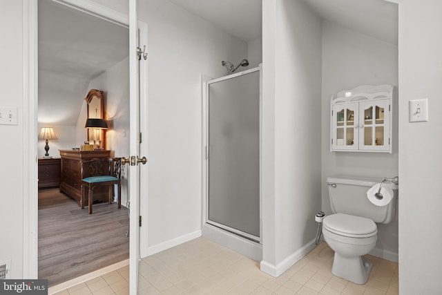 full bathroom with tile patterned floors, baseboards, a shower stall, and toilet