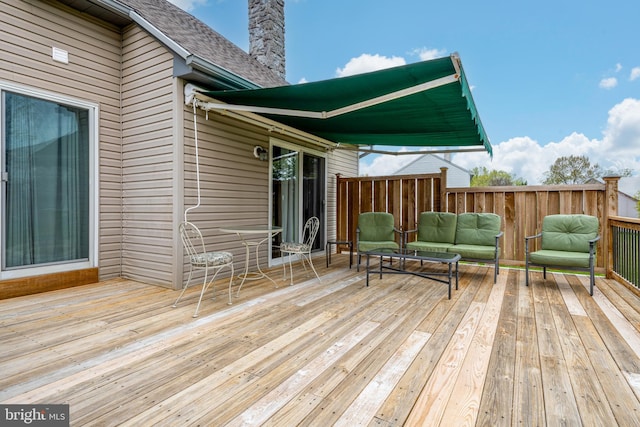 wooden deck featuring an outdoor living space