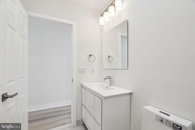bathroom featuring vanity and baseboards