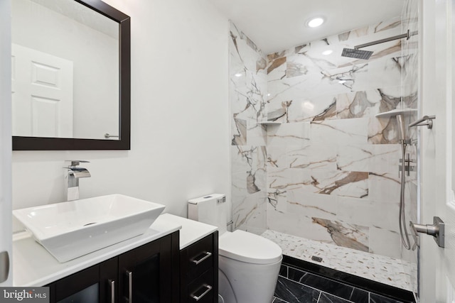 full bath with marble finish floor, toilet, vanity, and a marble finish shower