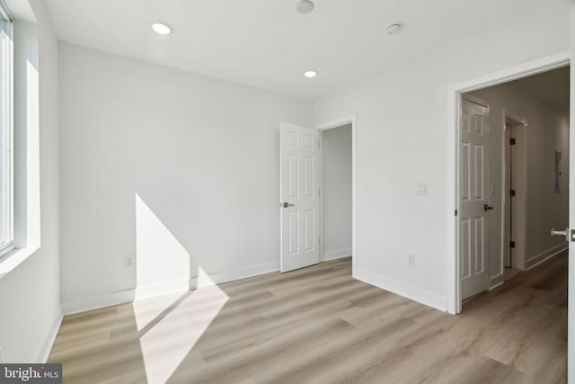 unfurnished room featuring light wood-style floors and recessed lighting