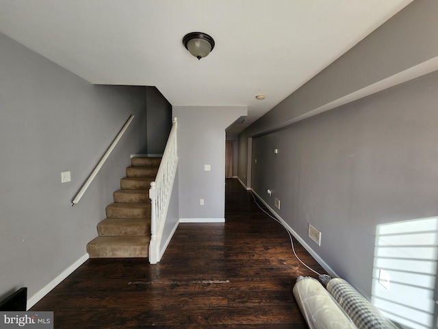 528 N Montford Ave, Baltimore, MD 21205 - stairway featuring baseboards, visible vents, and wood finished floors