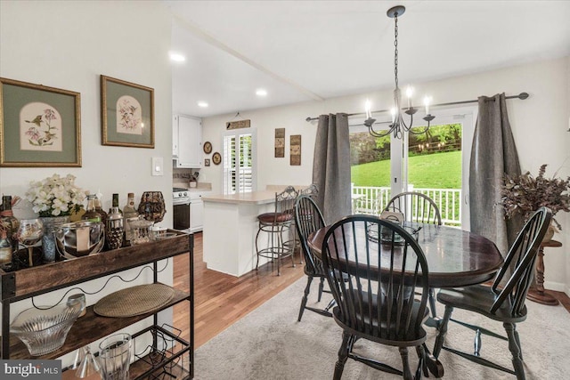 25112 Applecross Ter, Damascus, MD 20872 - dining space with light wood-type flooring, french doors, recessed lighting, and a chandelier