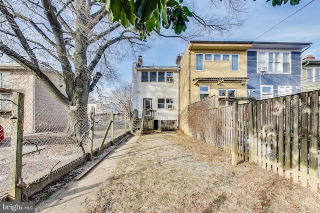 332 13th St SE, Washington, DC 20003 - back of house with a chimney and fence private yard