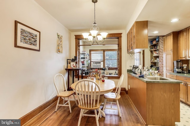 dining space with baseboards, cooling unit, a notable chandelier, recessed lighting, and hardwood / wood-style floors