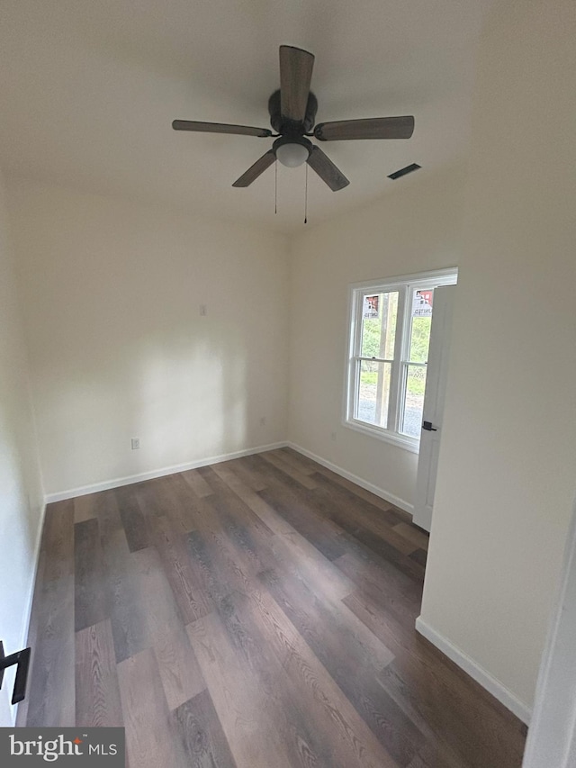 Meadow View Dr, Lost City, WV 26810 - spare room featuring a ceiling fan, dark wood-style flooring, and baseboards